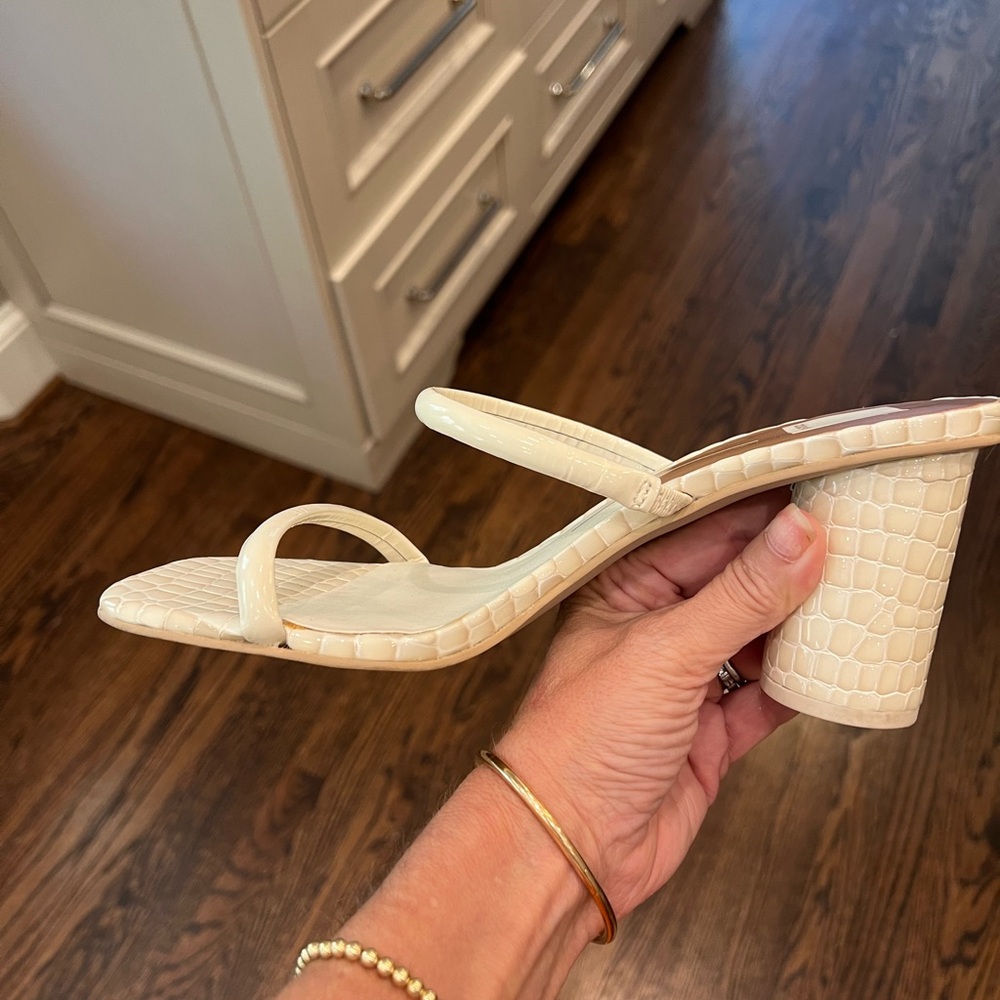 Dolce Vita sandal w/ heel in a cream embossed crocodile finish. Looks great on!